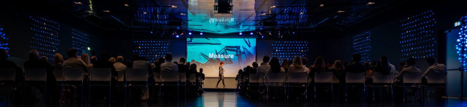 Prolet speaking at an event